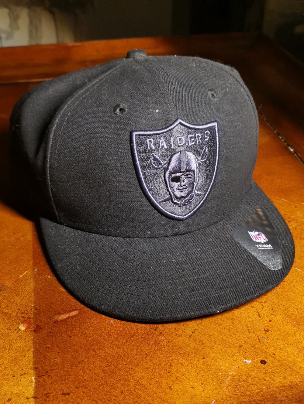 NFL Raiders Black Snapback Hat with Embroidered Shield Logo